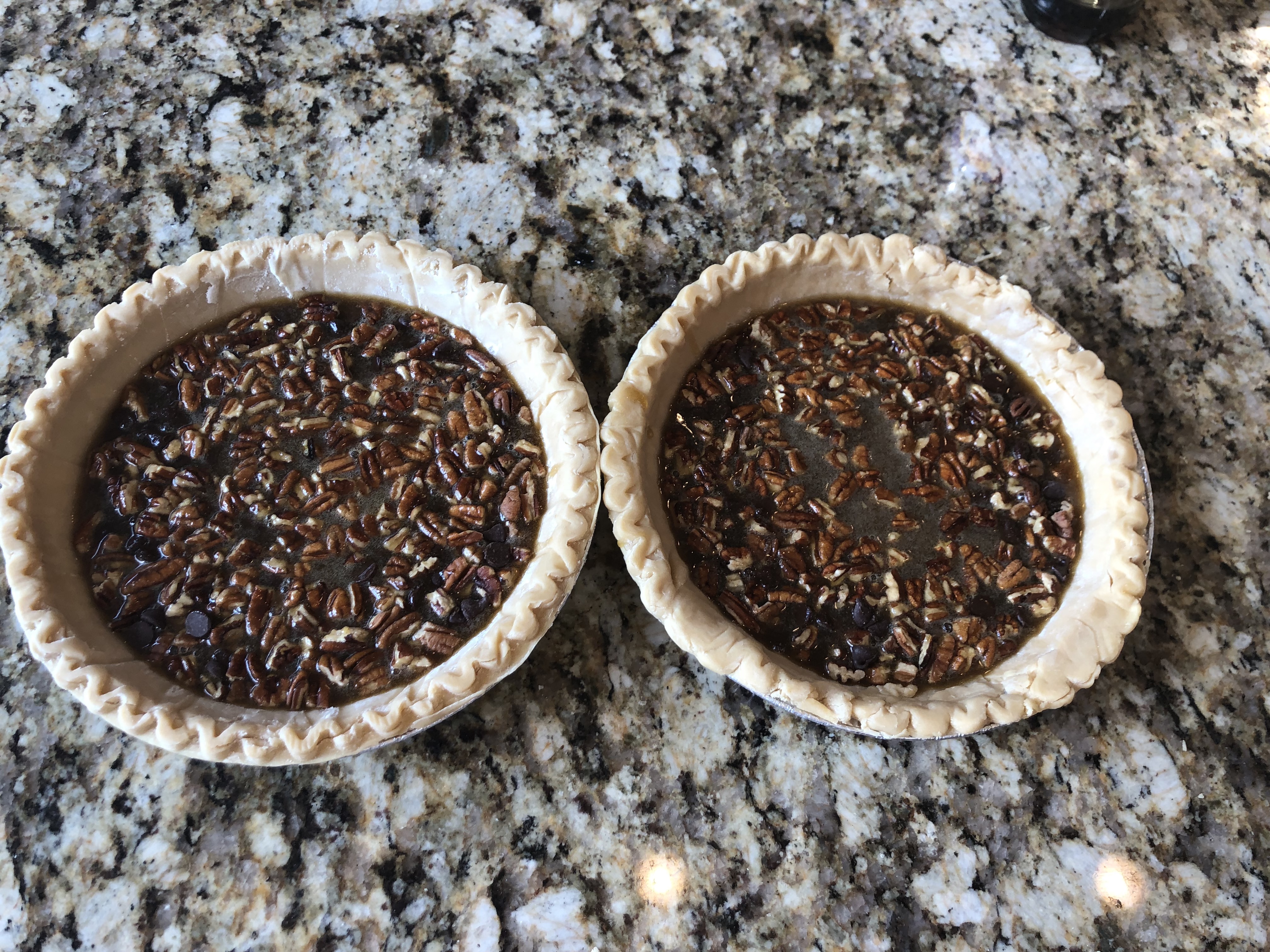 Bourbon chocolate pecan pies, ready to bake.
