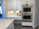 white cabinets, double ovens